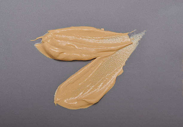 istock Light pale brown yellow gold color cosmetic cream texture 2205952928