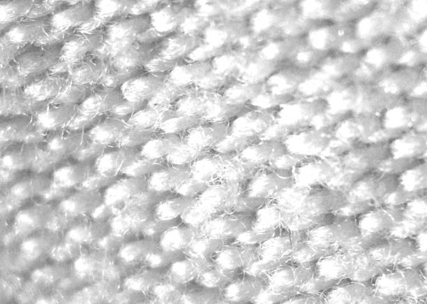 White texture of natural eco fabric, close up . Background of white rough fabric