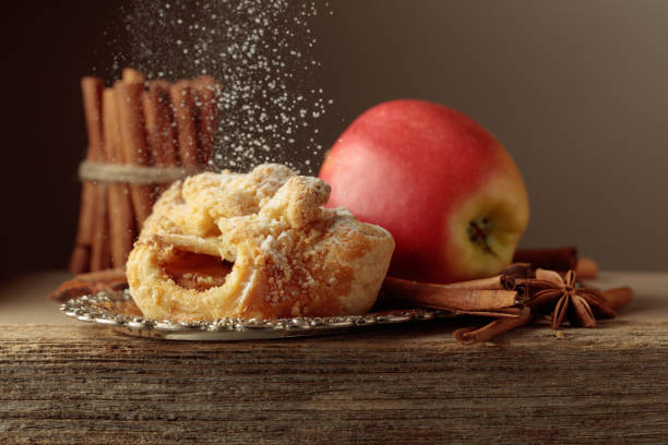 istock Viennese strudel with apple and cinnamon on old wooden table. 2205954265