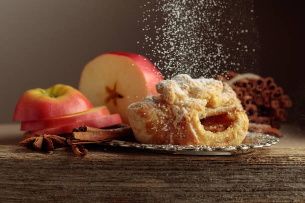 istock Viennese strudel with apple and cinnamon on old wooden table. 2205954273
