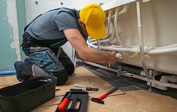 istock Man servicing the pipe system of a bathtub with hydromassage. 2205956806