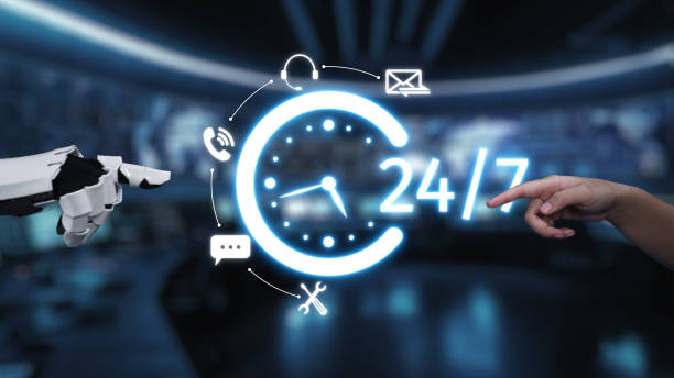 istock Futuristic communication concept with robot and human hand interacting, featuring 24-hour service symbol with digital icons for contact and assistance. Auvana 2205967801