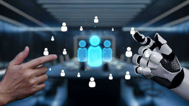 istock Human and Robot Interaction in a Modern Business Setting with Abstract People Icons Representing Collaboration and Technology Integration. Auvana 2205967872