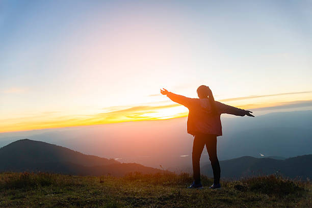 istock Hiker woman on the mountain background 2205974331