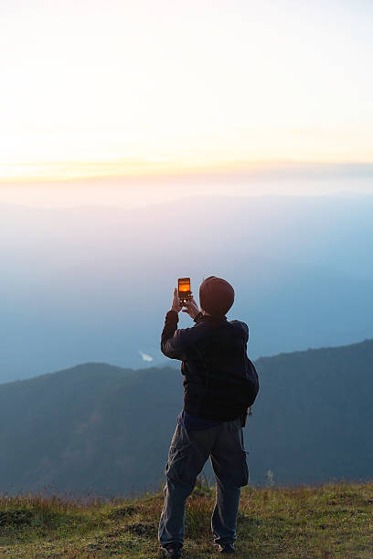 istock Hiker woman on the mountain background 2205974410