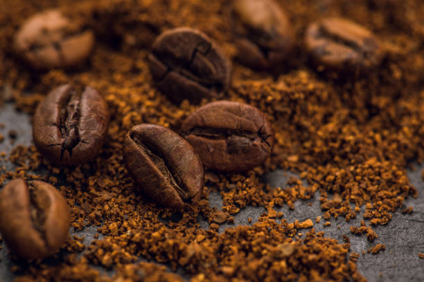 istock Roasted coffee beans and ground coffee. Macro shot. Coffee theme. 2205975007