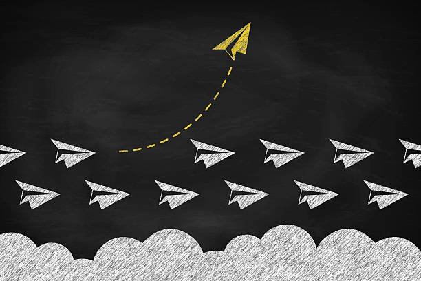 istock Yellow paper plane changing direction around the clouds in the sky. Think differently concept 2205976253