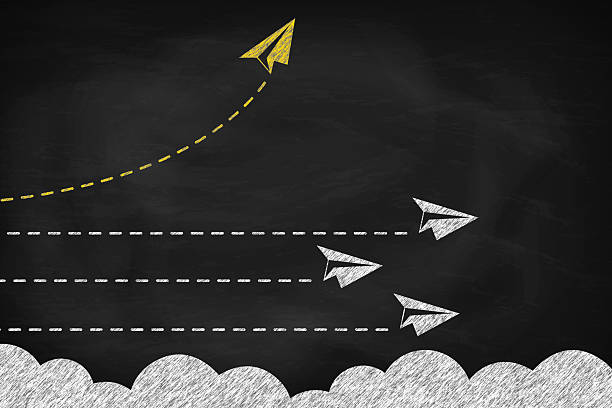 istock Yellow paper plane changing direction around the clouds on black chalkboard. New idea, change concept of business 2205976269