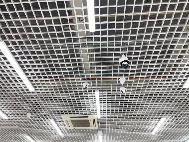 istock Video camera on the ceiling in a modern building. Video surveillance. 2205978362