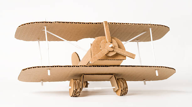 istock Handmade cardboard biplane on white background, DIY aviation craft 2205979165