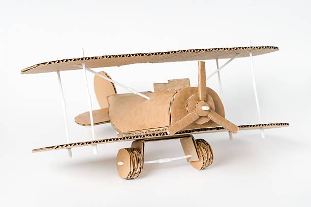 istock Vintage style handmade biplane from cardboard, aviation themed craft 2205979171