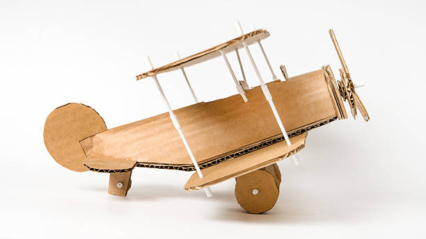 istock Handmade cardboard biplane side view, DIY vintage airplane model 2205979173