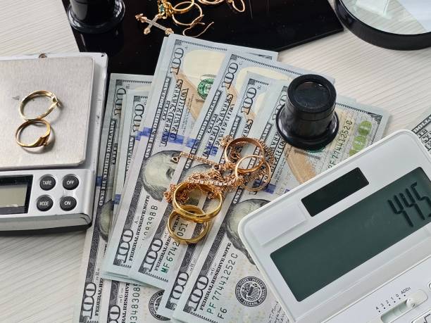 Jewelry and cash laid out on a table during assessment and valuation process