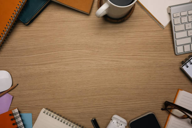 istock Top view of wooden work desk with blank space for text 2205982476