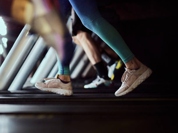 istock Unrecognizable athlete running on treadmill in a gym. 2205984406