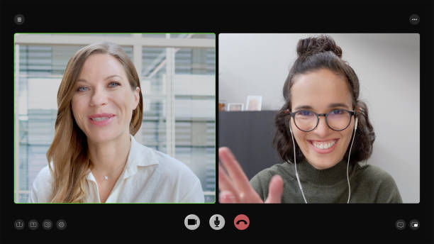 istock Smiling businesswomen attending video conference call 2205989726
