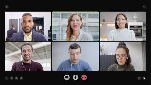 A diverse group of six professionals engaged in a virtual business meeting via video call, each participant appearing in individual video windows, with a modern and professional background setting.