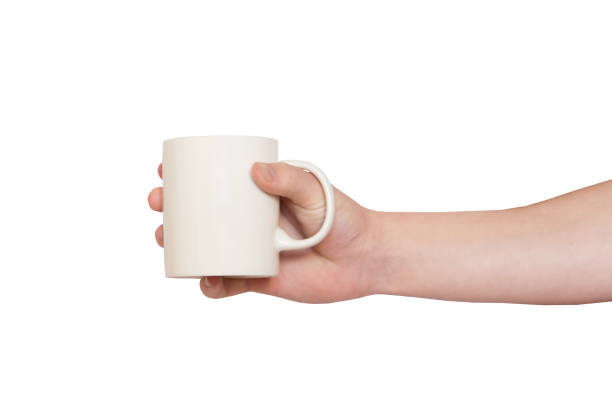 istock Hand holding White ceramic mug Isolated on white background 2206001375
