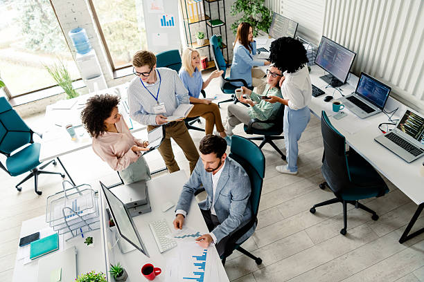 istock Professional business team collaborating in a modern office workspace during a daytime work session 2206001802