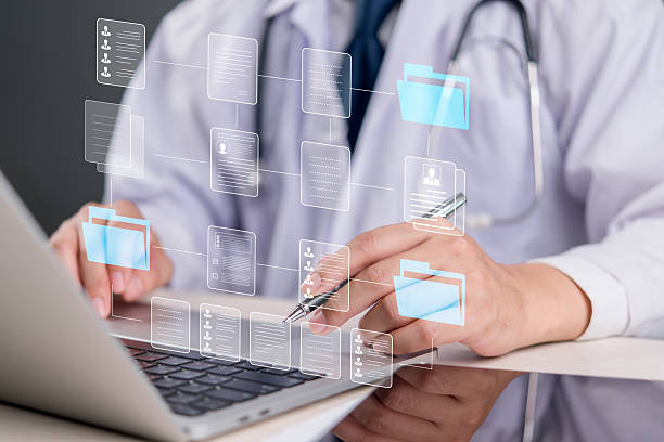 istock A medical professional analyzing patient data and medical documents through a digital interface. The scene emphasizes the use of electronic health records (EHR) in healthcare. 2206002166