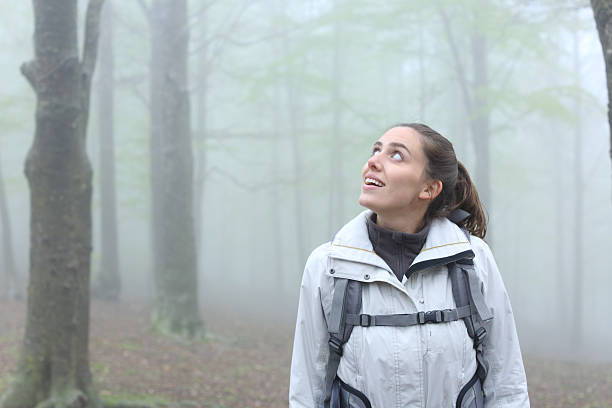 istock Happy trekker enjoying in the mountain looking at side 2206003682