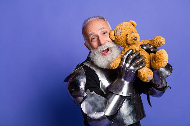 Elderly knight in full armor holding a teddy bear with a joyful expression on a purple background in a humorous medieval-themed concept
