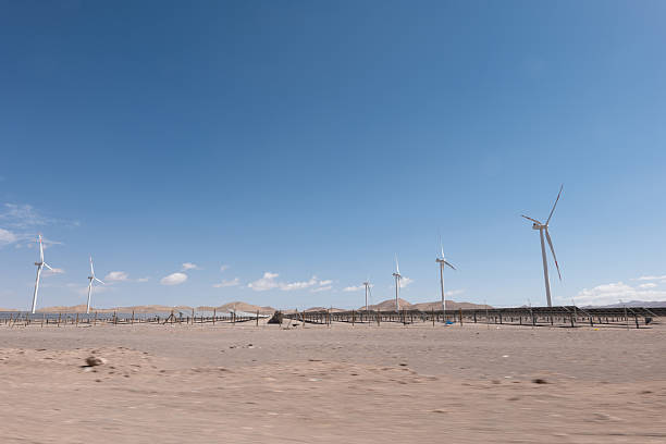 istock Wind Turbines Standing in Desert Landscape Under Clear Blue Sky 2206006850