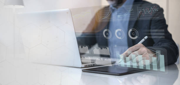istock Businessman using laptop and tablet analyzing economic data and sales growth on financial charts 2206007108