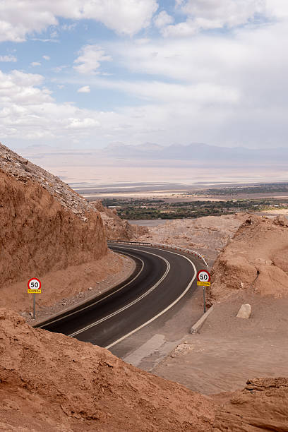 istock Desert Mountain Highway Curving Through Rugged Landscape 2206007181