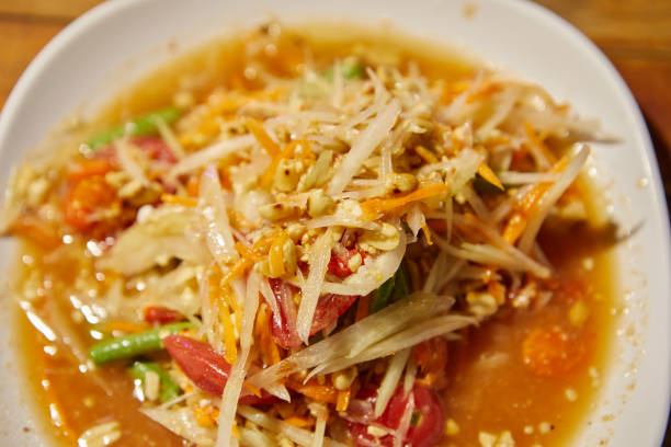 istock Sliced papaya and ingredients for making Som Tam  in plate 2206014533