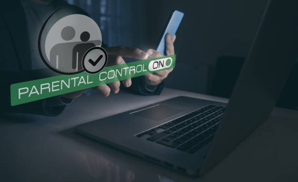 istock Parental control, child protection concept. Mum setting online content filter with laptop and phone. 2206015199