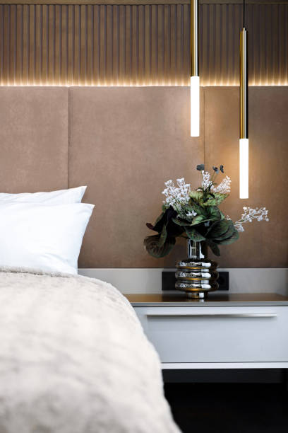 istock Modern bedroom decor with plants and stylish pendant lights 2206015472