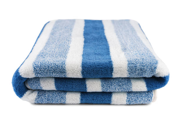 istock Carefully folded soft striped bath blue towel isolated on white background 2206015562