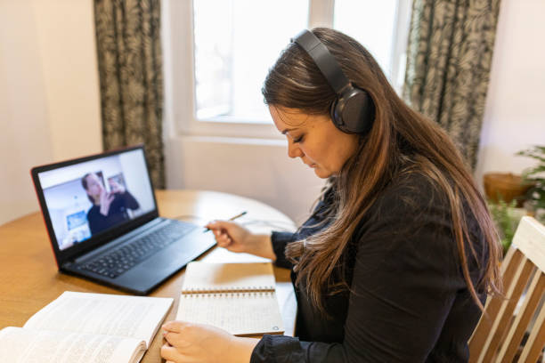 istock Woman freelancer noting information for planning project doing remote job via laptop computer. woman reading email on modern laptop device 2206016338