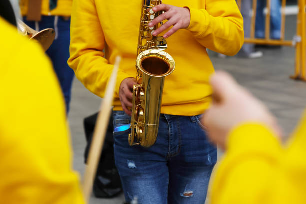 Close-up detail of a saxophone reed, with a shallow depth of field creating a dreamy bokeh effect in the background. A symbol of jazz, blues, and live musical expression.