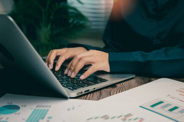 istock Person Working on Laptop with Business Charts and Data Analysis in Modern Office Environment, Business concept 2206018290