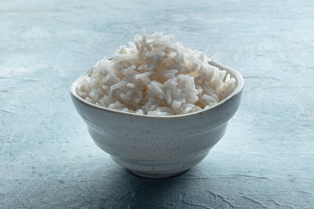 White rice, cooked. A bowl of boiled long grain rice White rice, cooked. A bowl of boiled long grain rice, a simple side dish jasmine rice stock pictures, royalty-free photos & images
