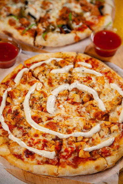 istock Chicken tikka masala thin crusted pizza baked in wood fired oven 2206024008
