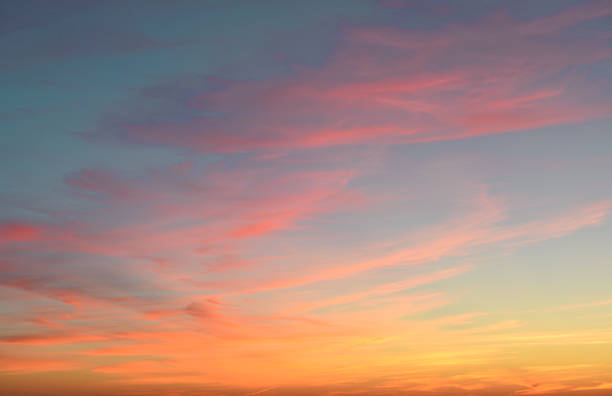 istock A beautiful sunset with pink and orange clouds in a blue sky 2206024325