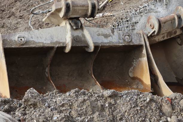 istock Heavy excavator bucket with soil remains and rust at a construction site. 2206024986
