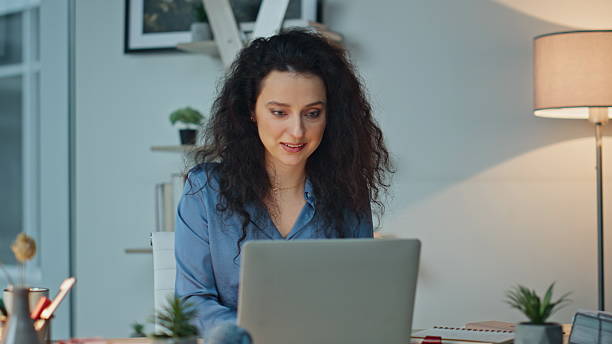 istock Joyful manager finishing work closing laptop. Closeup happy lady enjoying break 2206026921