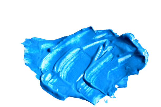 A spot of blue paint on a white background.