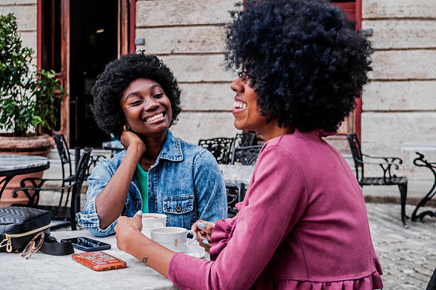 istock Young friends women talking and drinking coffee at sidewalk cafe 2206029784