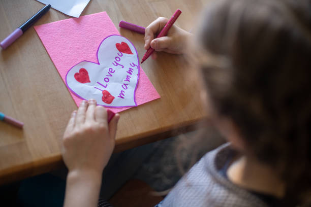 istock Little girl creating a present for her mummy, Mother's day. 2206029976