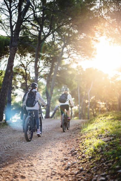 istock Group of Cyclists Enjoys Mountain Biking in Nature 2206031294