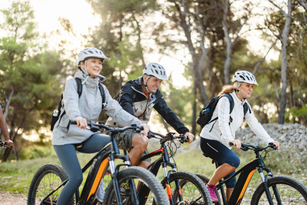 istock Group Of Friends Mountain Biking Through Nature 2206031295