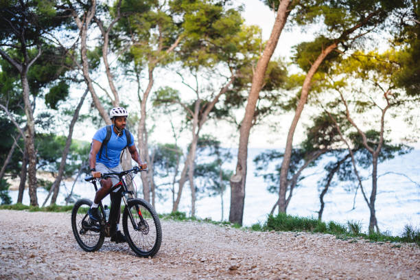 istock Cyclist Riding Mountain Bike in Scenic Forest 2206031296