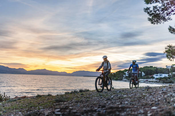 istock Cycling Adventure by the Sea at Sunset 2206031336
