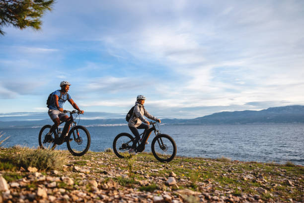 istock Active Bikers Enjoying Scenic Trail by the Sea 2206031337