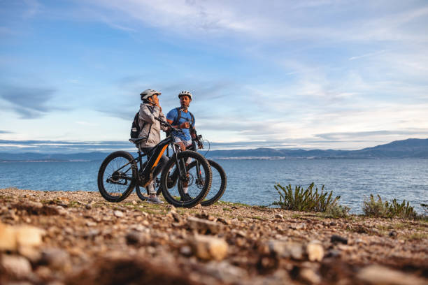 istock Two Men Enjoy Mountain Biking by the Sea 2206031345